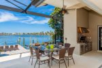 Southern Comfort Lanai with outside kitchen and dining area overlooking the Lake with  Gulf access 